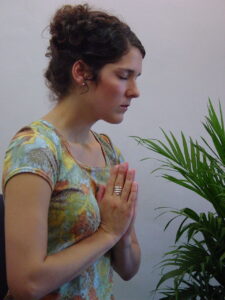  Women holds her hands in a pray position