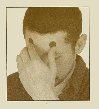 Man holding his forehead 