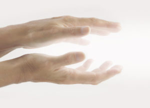 Hands with light between them