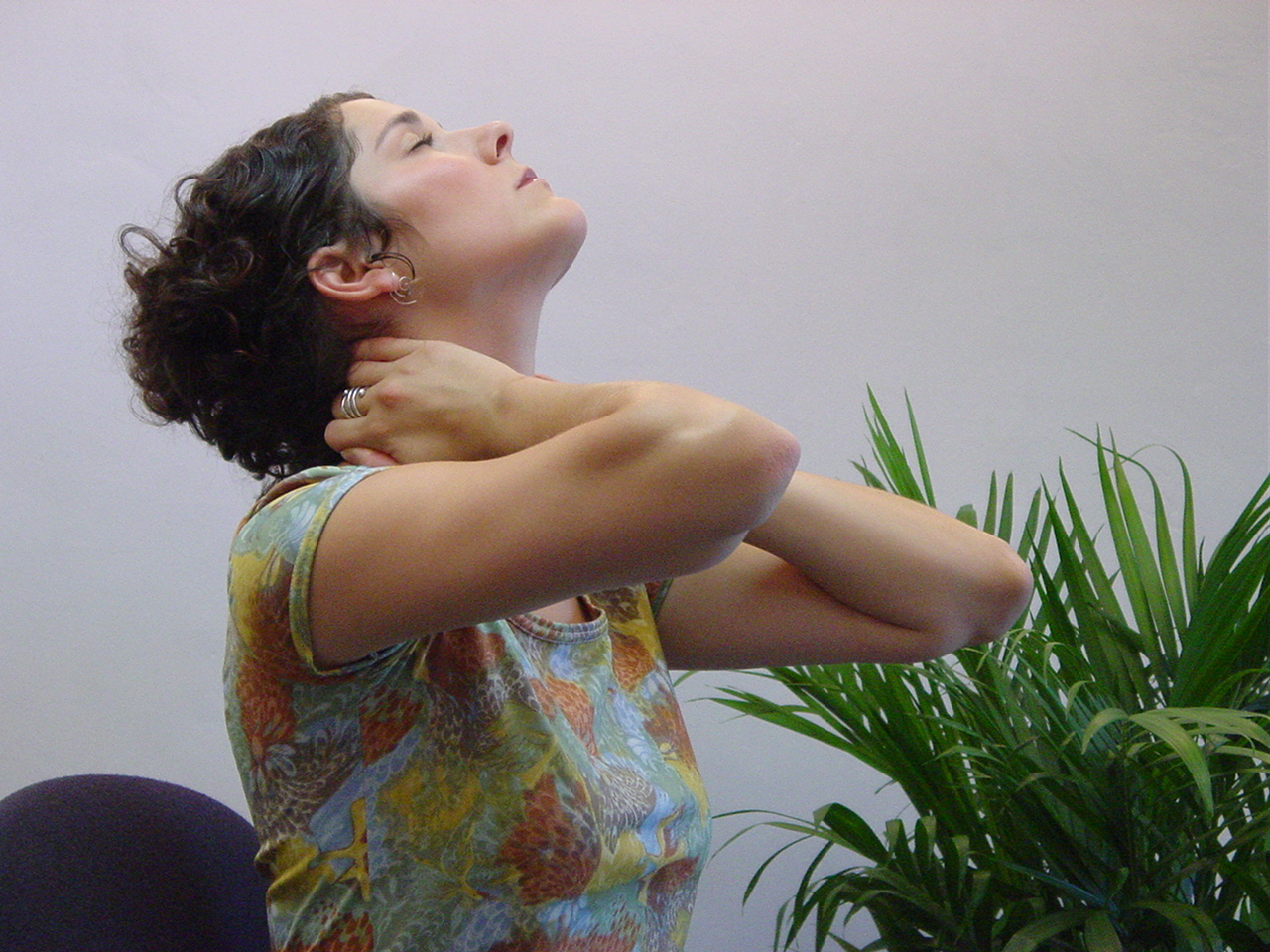 Woman holding acupressure points.