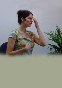 Woman holding acupressure points.