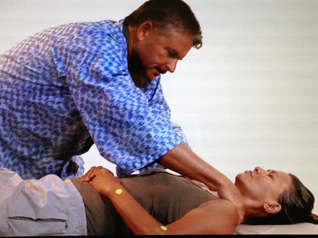 Michael Reed Gach giving Shiatsu treatment.